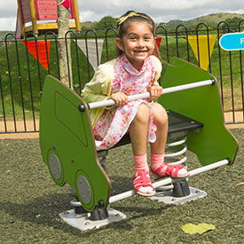 Girl on a car shaped springer